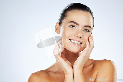 Image of Skincare, beauty and portrait of a woman in a studio with a cosmetic, makeup and natural face routine. Health, wellness and female model with an organic healthy facial treatment by a gray background.