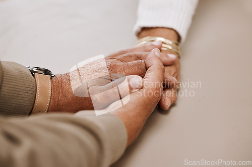 Image of Support, trust and holding hands, senior couple in therapy or marriage counselling session. Love, care and understanding between elderly man and woman together in hope, empathy and help in retirement