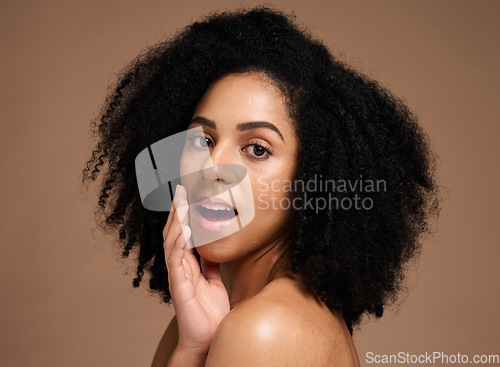 Image of Face, beauty and black woman with skincare secret in studio on a brown background. Makeup cosmetics, portrait and young female model with glowing, healthy and flawless skin after spa facial treatment