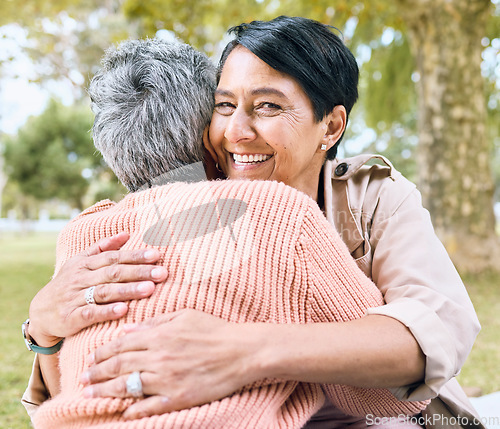 Image of Couple of friends, retirement and portrait hug in nature park, grass garden and relax environment for support and love. Smile, happy women and bonding elderly senior in birthday celebration embrace