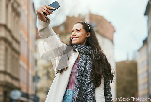 Image of Travel, phone or woman takes a selfie for social media in city of Paris walking on a relaxing holiday vacation or weekend. Smile, pride or happy girl tourist taking fun pictures alone to post online