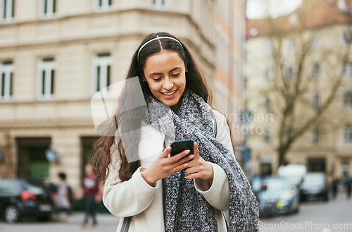 Image of Travel, phone or woman on social media in city of Paris walking on a relaxing holiday vacation or weekend. Smile, chat or happy girl tourist typing or texting a message on social networking website