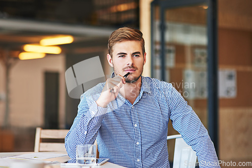 Image of Corporate, thinking and businessman with an idea, planning and working at a desk at a company. Think, strategy and thoughtful employee at an office for professional entrepreneurship in the workplace