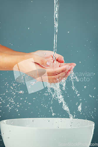 Image of Woman hands, water splash with sink, washing and skin isolated on studio background, hygiene and skincare with beauty. Liquid, health and wellness with natural cosmetics, body care and shower