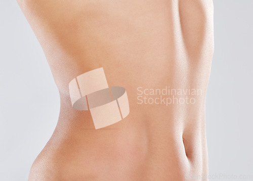 Image of Woman, stomach and slimming wellness or skincare for plastic surgery, liposuction or digestion nutrition in white background. Model, belly and tummy tuck or cosmetics dermatology healthcare in studio