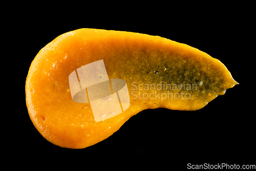 Image of vegetable puree on black background