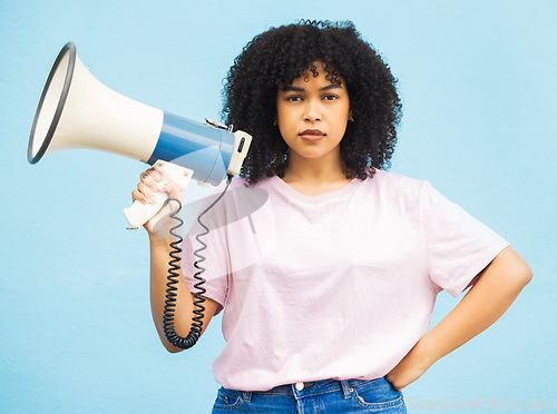 Image of Megaphone announcement, serious and portrait of black woman protest for democracy vote, justice or human rights rally. Racism speech, microphone noise and studio speaker isolated on blue background