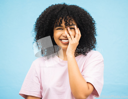 Image of Hands, smile and portrait of black woman on blue background with makeup, cosmetics and fashion mockup. Beauty, advertising and happy face of girl with copy space for sale, promotion news and discount