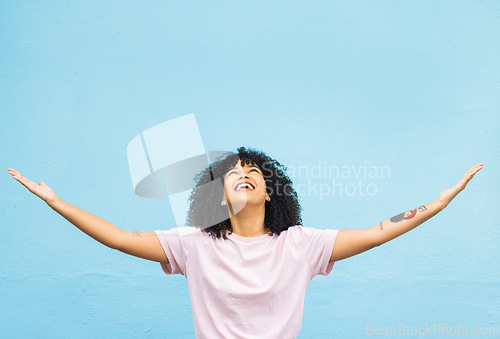 Image of Black woman, happy and open arms in studio for marketing mockup, happiness celebration and excited in blue background. African girl, smile and surprised hands gesture or surprise growth development
