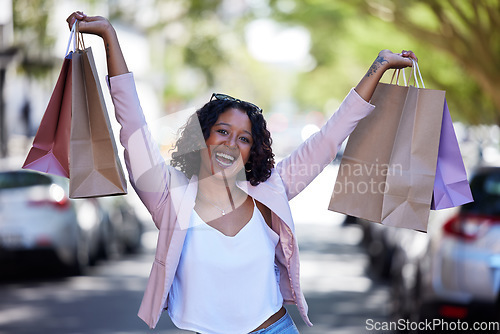 Image of Black woman outdoor, shopping and retail for clothes, purchase and bags. Female client, customer and Nigerian girl in city, sale products and boutique items for spree, smile and designer brand gifts