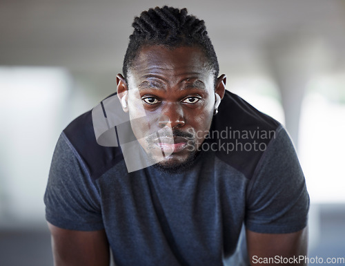 Image of Black man, face and fitness rest with music for exercise workout, cardio training and healthcare wellness outdoor. African athlete, audio focus motivation and sports runner break or mindset vision