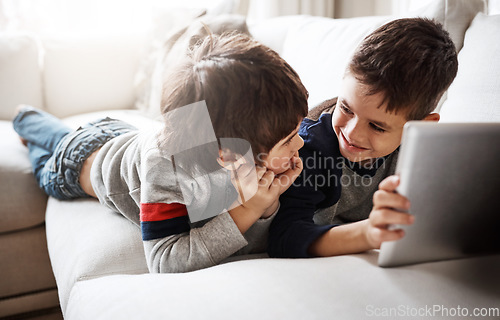 Image of Kids, bonding or digital tablet for movie streaming, social media or esports gaming on family home sofa. Smile, happy or children brothers on technology for education video, learning support or help