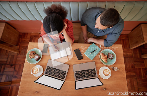 Image of Working, coffee shop and laptops with mockup and business worker group planning a strategy. Table top, above and cafe work of a web design staff working on a ecommerce designer innovation project