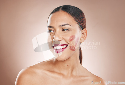 Image of Beauty, makeup and woman with lipstick and cosmetics on a studio background for dermatology, fashion and salon mockup. Face and headshot of aesthetic female model with a smile, glow and healthy skin