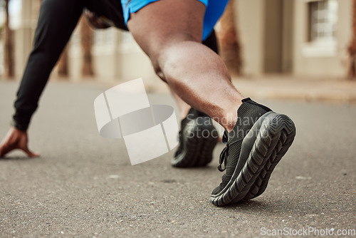 Image of Runner, fitness or black man ready to start running exercise, cardio sprinting workout or sports training on city road. Back view, focus or healthy African athlete with mission, mindset or body goals