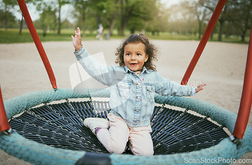 Image of Play in playground, girl child in park with outdoor fun, early childhood development with toddler on trampoline. Kid, freedom and energy, playful and playing during holiday and growth in nature