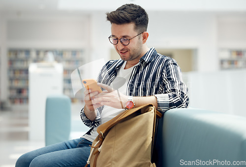 Image of Library, reading and man with book on sofa for education, studying and academic research. University, scholarship and student with backpack learning, reading book and knowledge in college bookstore