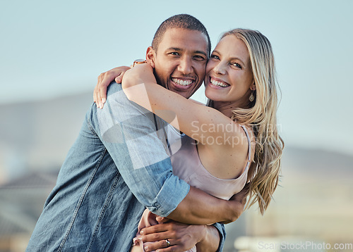 Image of Interracial, happy couple and smile portrait hug of people in summer with happiness or love. Couple, outdoor and smiling for marriage, care or vacation gratitude in sunshine together feeling calm