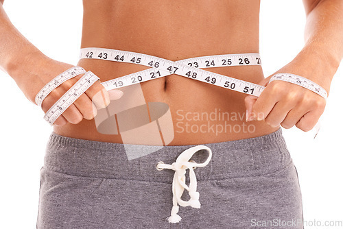 Image of Fitness, health and woman with tape measure for stomach in studio isolated on a white background. Diet, wellness and slim female model measuring waist to track weightloss goals, progress or targets.