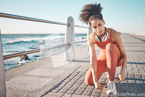 Image of Portrait, exercise and black woman tie shoes, promenade and fitness for energy, wellness and training. African American female, lady and runner tying sneakers, workout and ready for run and practice