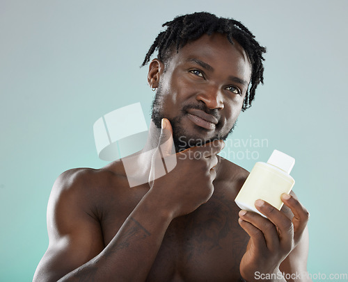 Image of Skincare, black man and cream for cosmetics, wellness and natural beauty with guy on grey studio background. African American male, confident person and gentleman with lotion for smooth or clear skin