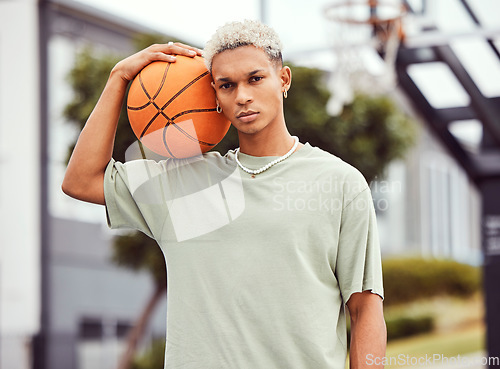 Image of Fashion, fitness or portrait of black man with basketball in training practice, workout or exercise on city basketball court. Sports, game or male model with cool trendy clothes, Motivation or talent