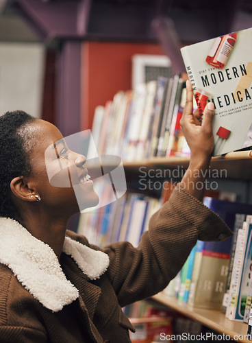 Image of Black woman, student and book in library for medical exam, pills and healthcare education, learning about pharmaceutical drugs. Reading information, learn and study, medicine research with pharmacy