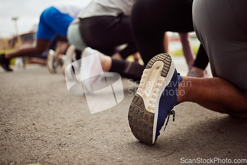 Image of Shoes, fitness or people at the start of a marathon race with performance goals in workout or runners exercise. Back view or healthy group of sports athletes ready for running contest on city road