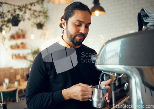 Image of Small business, cafe barista and man working on morning espresso machine in a restaurant. Waiter, milk foam and breakfast latte of a worker from Brazil busy with drink order service as store manager