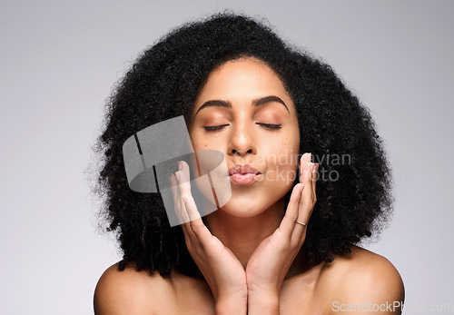 Image of Face kiss, skincare beauty and black woman with eyes closed in studio isolated on a gray background. Natural cosmetics, makeup and young female model pouting lips satisfied with spa facial treatment.