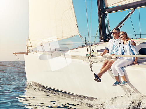 Image of Luxury cruise, couple and yacht while on a boat trip at sea for a adventure, holiday or vacation in summer. Man and woman sailing together on a cruise ship on the ocean with love, happiness and care