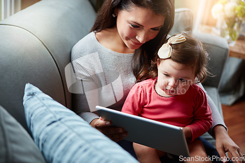 Image of Mother, baby and tablet on sofa watching educational video online on streaming service in home. Love, family time and woman with girl child smile on couch to watch kids movie or cartoon on website.