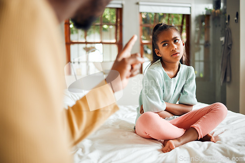 Image of Discipline, angry and dad with child on bed with unhappy, naughty and annoyed expression in house of black family. Serious conflict, problem and upset father disappointed with young kid in bedroom.