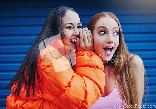 Image of Friends, gossip in ear and women in laughing at secret joke in city with smile and shock on face. Urban secrets, rumor and whisper in ears, gen z woman and friend laugh at funny story on walk in town