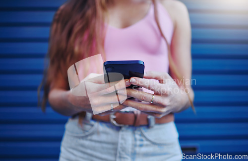 Image of Woman, hands and phone for social media, texting or chatting in communication or networking. Hand of female, person or lady typing on mobile smartphone for browsing, advertising or conversation