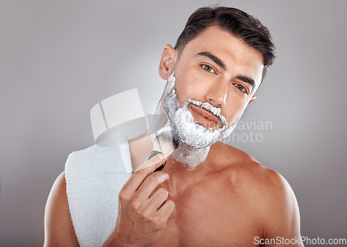 Image of Man, portrait and shave foam for cleaning, grooming hygiene and skincare wellness or cosmetics treatment. Shaving brush, facial cream and dermatology skin or beard cleansing for face hair removal