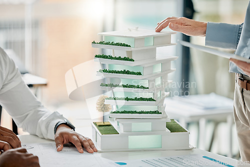 Image of Building model, diversity and hands of architect working on real estate development, architecture engineering or planning. Project management, teamwork collaboration and woman review 3d house design
