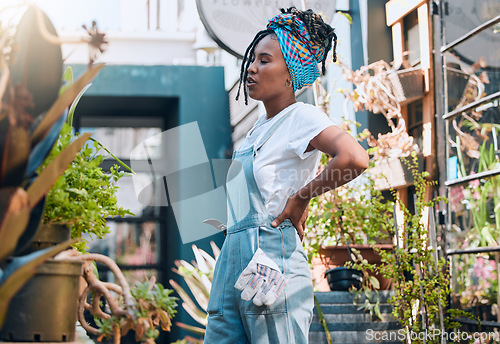 Image of Tired black woman, business owner and plant shop for garden, nursery or greenhouse retail. Entrepreneur working in plants startup store or market for sustainability, environment and gardening growth