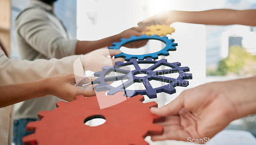 Image of Business people, toys and gears at job for teamwork, sign or symbol with solution, trust and solidarity. Corporate group, learning or development at team building exercise in city workplace for goals