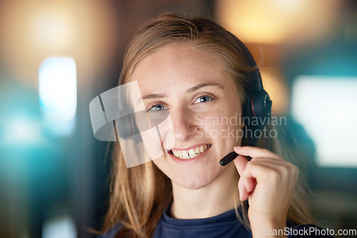 Image of Call center, smile and portrait of business woman at night in customer service, consulting or technical support. Help desk, advisory or telemarketing with employee and microphone for phone call sales