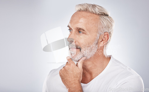 Image of Face, thinking and senior man in studio isolated on a gray background mock up. Skincare, cosmetics and retired elderly male lost in thoughts or contemplating ideas for beauty, grooming and wellness.