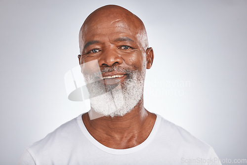 Image of Senior black man, face and self care with skincare, dermatology and cosmetics for clean, glow and fresh skin. Headshot of African male with a beard on grey studio background for beauty spa treatment