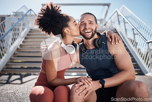 Image of Sports, love and woman kissing man on stairs in city on break from exercise workout. Motivation, health and fitness goals, couple rest and kiss with smile on morning training run together in New York
