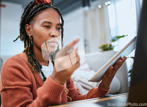 Image of Black woman, tablet and reading on laptop for online email communication, pointing finger and planning strategy in home office. African girl, student and working on digital tech devices for elearning