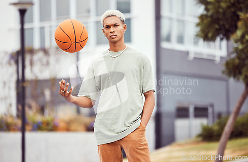 Image of Fashion, fitness or portrait of black man with basketball in training practice, workout or exercise on city basketball court. Sports, game or male model with cool trendy clothes, Motivation or talent