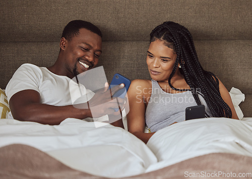 Image of Love, smartphone and black couple in bed, social media and connection in the morning. Romance, man and woman in bedroom, cellphone and online reading for bonding, loving and relax together on weekend