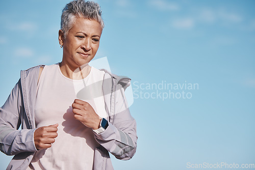 Image of Senior woman, exercise run and blue sky outdoor fitness for retirement sports wellness, health workout and cardio training. Elderly athlete, energy motivation and cardio runner freedom and lifestyle