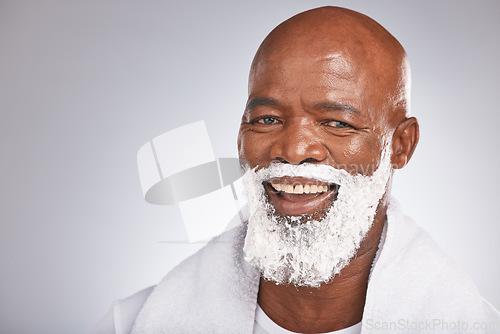 Image of Face, shaving cream and portrait black man with smile, beard and skincare spa treatment on grey background. Health, mock up and facial hair, happy mature man morning shave with product placement.