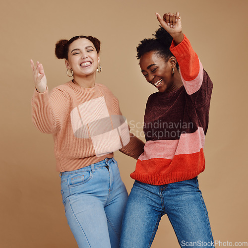 Image of Happy, teenager and girl with dance and friends, young and trendy with gen z style, fun and freedom against studio background. Laughing, funny and dancing with stylish youth, energy and marketing