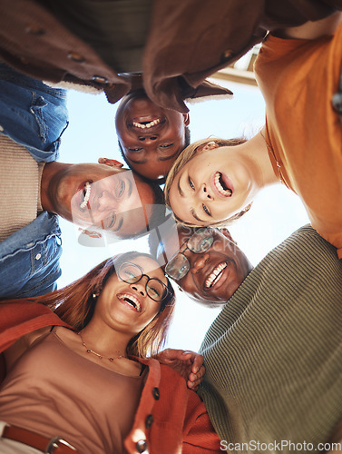 Image of Group huddle, portrait smile and hug below for community, teamwork or trust together in the outdoors. Happy people smiling in diversity for solidarity or unity for team support or friendship